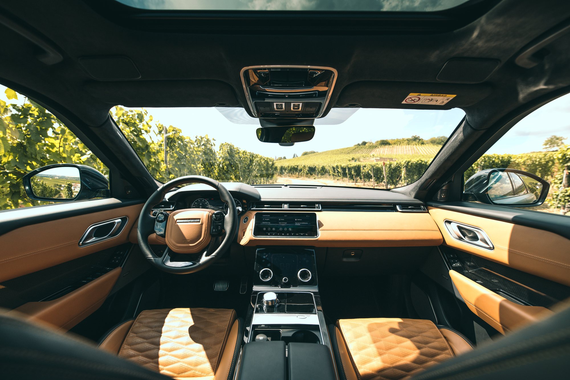 Range Rover Velar cabin, vineyard through the windshield